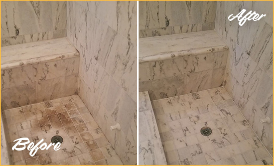 Before and After Picture of a Dirty Manhattan Marble Shower Cleaned to Eliminate Dark Stains